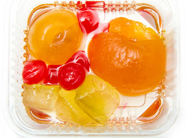 Italian Mustard with candied fruit and syrup on white bowl Italian Mustard with candied fruit and syrup on white bowl mustard fruits stock pictures, royalty-free photos & images