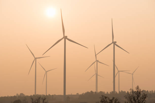 силуэт ветра турбины на закате - wind стоковые фото и изображения