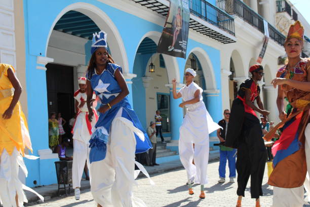 Havana, Cuba - December 20, 2019: Cuban young people dance with typical dresses for tourists in the Callejon de Hamel