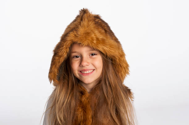 Smiling little girl posing in studio
