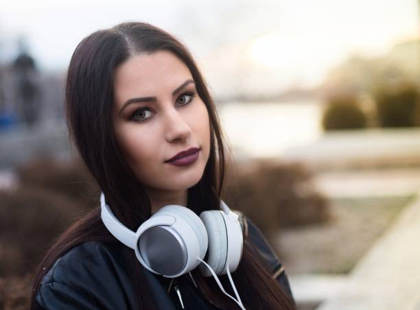 istock Young beautiful woman with headphones 644044996