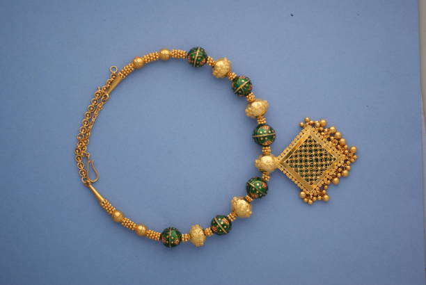 istock Gold square necklace with green enamel. 644047692
