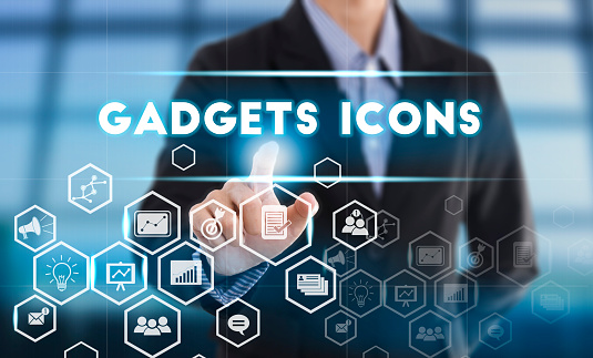 Businessman hand chooses Gadgets icons wording on interface screen. internet technology service concept. can used for cover page presentation and web banner.