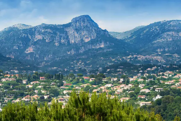 Scenic countryside of Saint-Paul-de-Vence in France, with the Maritime Alps mountains in the distance.