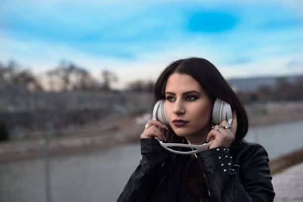 istock Young beautiful woman with headphones 644060078