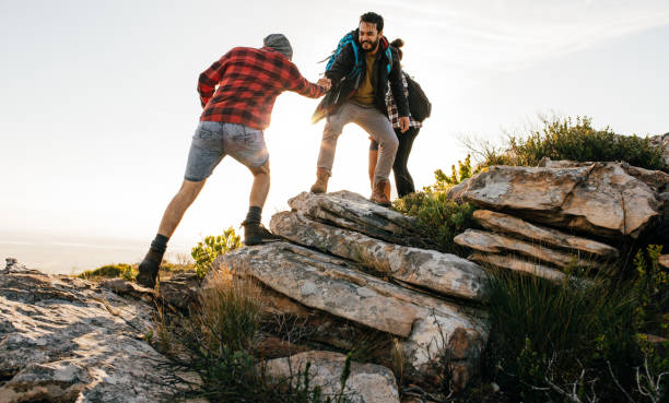 istock Group of hikers walking in the nature at sunset 644067010