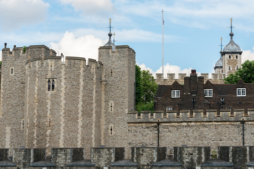 London, UK - June 24, 2016: The exterior of the Tower of London late in the day along the Thames River.