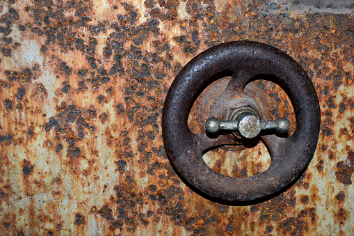 Background to the door of the old rusty steel safe