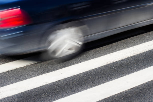 istock Black car with motion blur on street 644077240