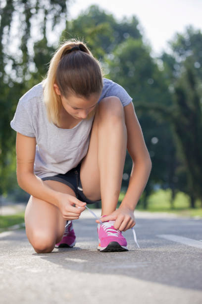 istock Preparation for running-tying a shoelace 644077306