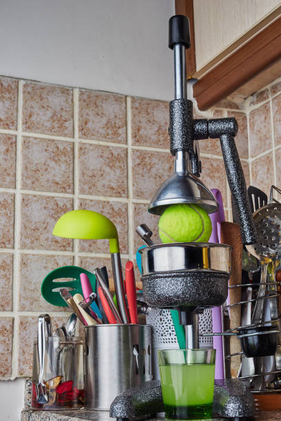 istock Tennis ball in the Orange squeezer 644077478