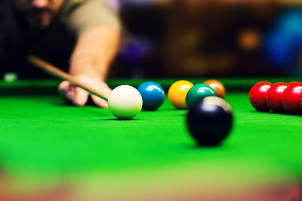 istock playing snooker - man aiming the cue ball 644080490