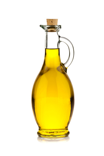 Vertical shot of a single olive oil bottle isolated on white background. DSRL studio photo taken with Canon EOS 5D Mk II and Canon EF 70-200mm f/2.8L IS II USM Telephoto Zoom Lens