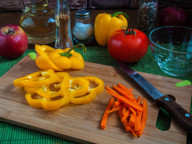 istock Sliced vegetables on a wooden board 644090152