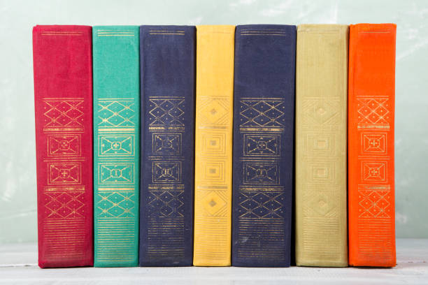 istock A stack of books on shelf and green background 644096740