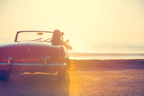 istock Young woman in a car at the beach. 644101764
