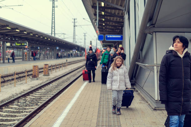 istock Family at the train station 644104646