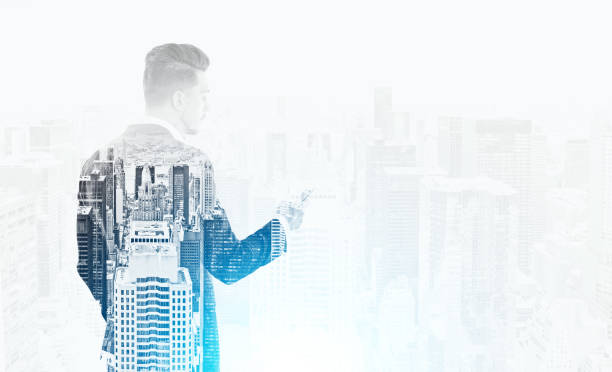 istock Close up: man with phone and cityscape 644105658