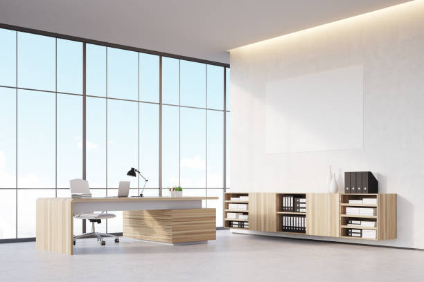 istock Corner of a CEO office with poster 644108996