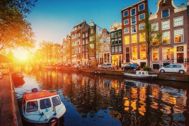 istock Amsterdam canal. Fantastic sunset is reflected in the water 644109096