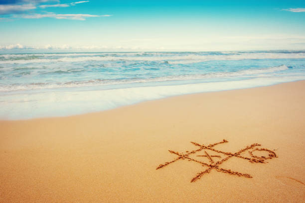 istock The drawings in the sand at the beach 644109122
