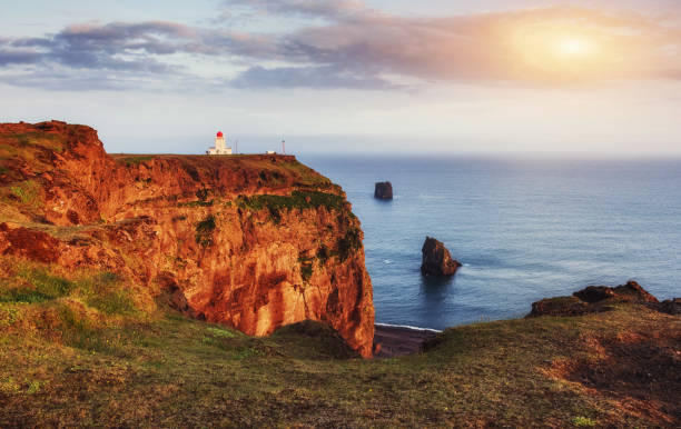 istock Beautiful white lighthouse at Cape Dyrholaey, South Iceland 644112048