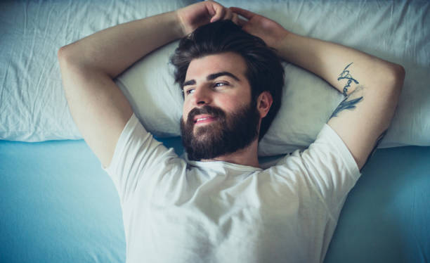istock Hipster laying down in bed at morning 644119562
