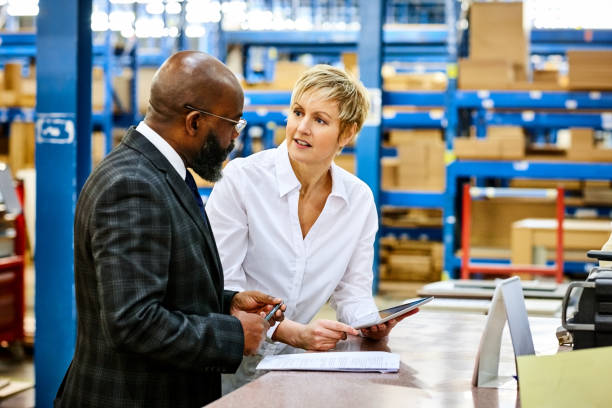 istock Business people discussing work in factory 644128326