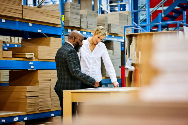 istock Office coworkers in storage warehouse 644128344