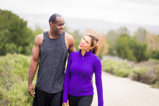 istock Attractive Diverse Couple Working Out 644135244