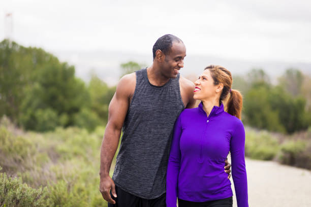 istock Attractive Diverse Couple Working Out 644135266