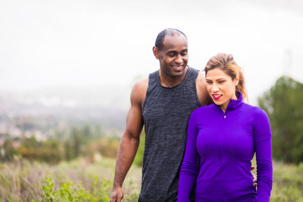 istock Attractive Diverse Couple Working Out 644135316