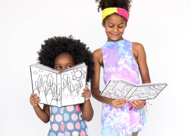 istock Children Girlfriends Reading Book Education Togetherness Studio Portrait 644151462