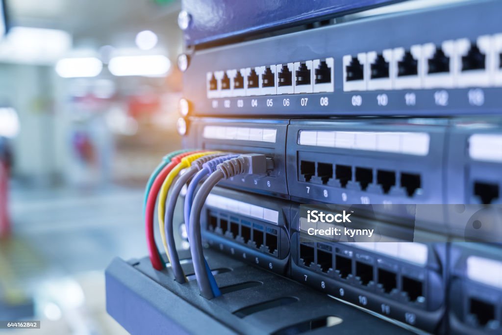 network cables and hub closeup network cables and hub in data room Switch Stock Photo