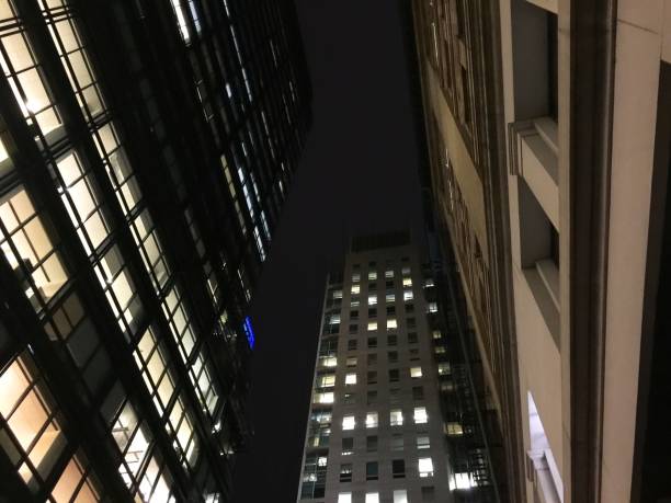 istock Looking up at the sky between skyscappers 644172622