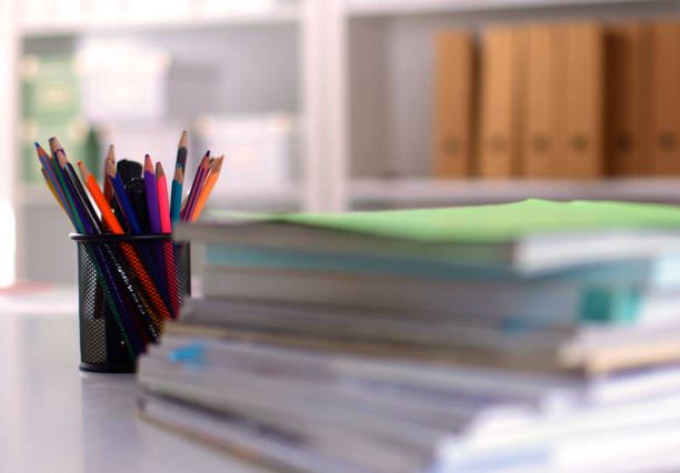 istock close up of stack of papers on white background 644175906