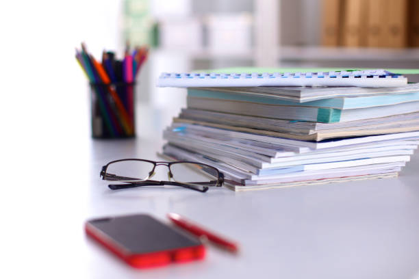 istock Group of multicolored office folders and glasses 644176198