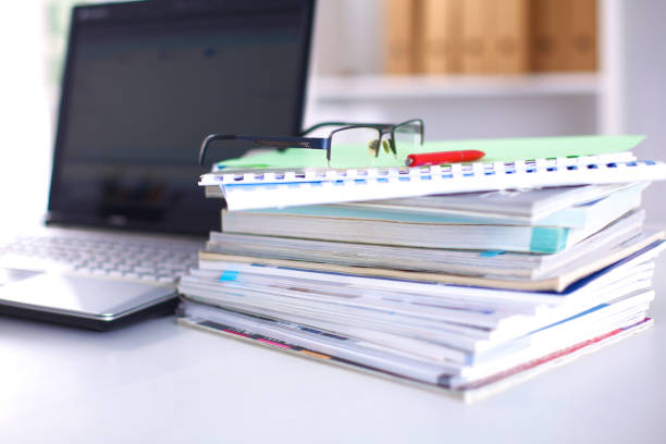 istock Group of multicolored office folders and glasses 644176656