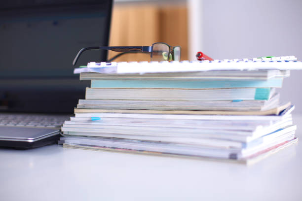 istock Group of multicolored office folders and glasses 644176696
