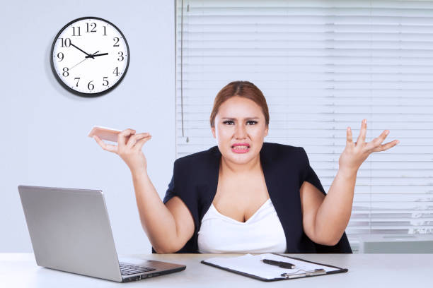 istock Young woman shrugs her shoulder 644182176