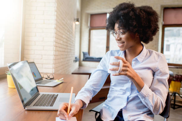 istock Businesswoman with coffee cup at the office 644185594