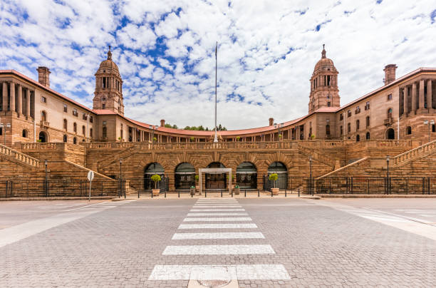 The Union Buildings in Pretoria, South Africa The Union Buildings in Pretoria, South Africa. This is where parliament is held in South Africa every six months alternatively with Cape Town. The two bell towers represent the Afrikaans and English languages. Seen from the front with the pedestrian crossing. pretoria stock pictures, royalty-free photos & images