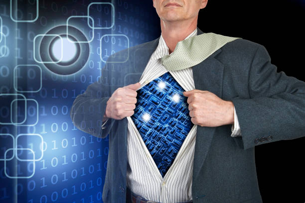 Businessman showing superhero suit underneath his shirt standing against technology background