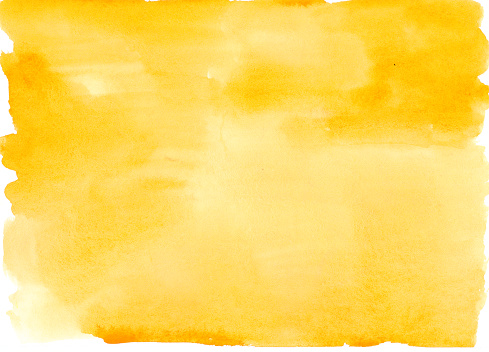 Watercolor on paper. An abstract artistic bright yellow watercolor background texture.