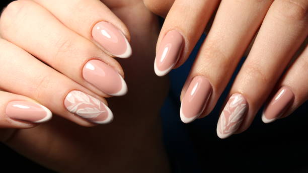 istock Gentle design french manicure with feathers 644210652