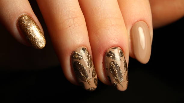 istock Very best nail design, manicures coffee with golden feathers 644216562