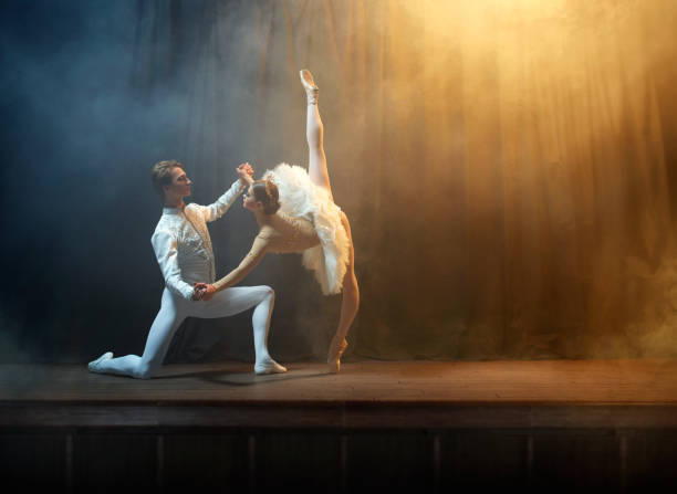 istock Ballet dancers performing on stage in theatre 644217116
