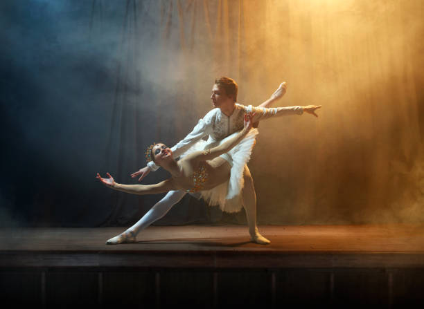 istock Ballet dancers performing on stage in theatre 644217124