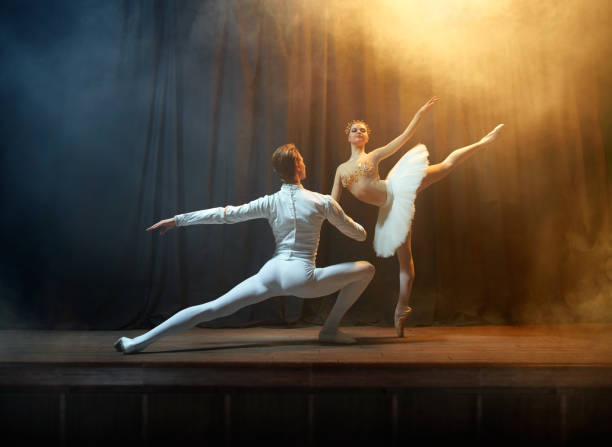 istock Ballet dancers performing on stage in theatre 644217134