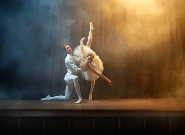 istock Ballet dancers performing on stage in theatre 644217140